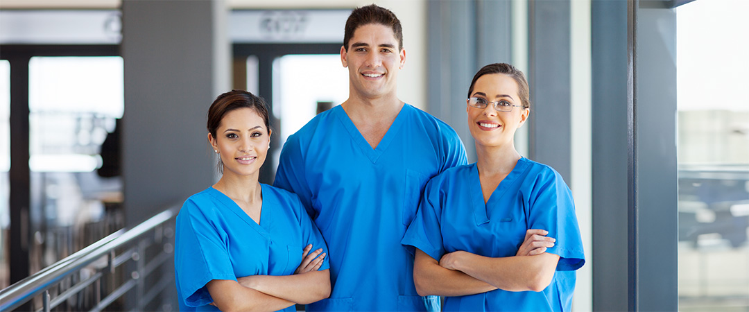 Three skilled nurses smiling for a picture